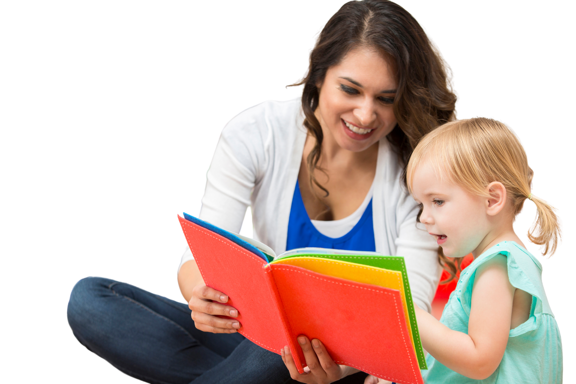 Hispanic preschool teacher reading a book to cute toddler girl